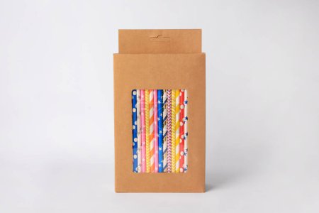 Photo for Box with many paper drinking straws on light grey background - Royalty Free Image