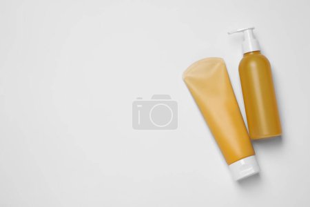 Photo for Different cleansers on white background, flat lay with space for text. Cosmetic product - Royalty Free Image
