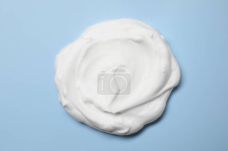 Photo for Sample of shaving foam on light blue background, top view - Royalty Free Image