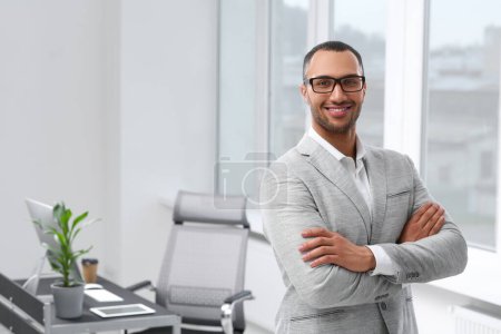 Photo for Smiling young businessman in office. Space for text - Royalty Free Image