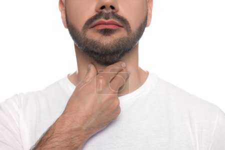 Foto de Sistema endocrino. Hombre haciendo autoexamen de la tiroides sobre fondo blanco, primer plano - Imagen libre de derechos