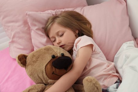 Photo for Little girl snoring while sleeping in bed - Royalty Free Image