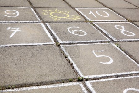 Photo for Hopscotch drawn with white chalk on street tiles outdoors, closeup - Royalty Free Image