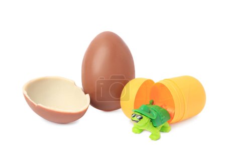 Photo for Slynchev Bryag, Bulgaria - May 24, 2023: Halves of Kinder Surprise Egg, plastic capsule and toy turtle isolated on white - Royalty Free Image