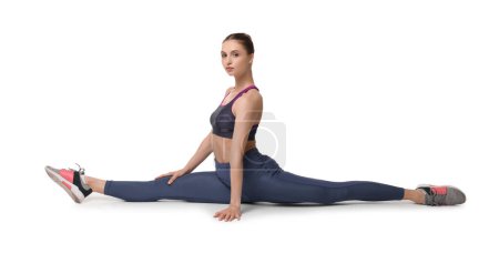 Téléchargez les photos : Entraînement de yoga. Jeune femme étirant sur fond blanc - en image libre de droit