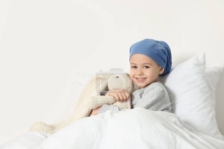 Photo for Childhood cancer. Girl with toy bunny in hospital - Royalty Free Image