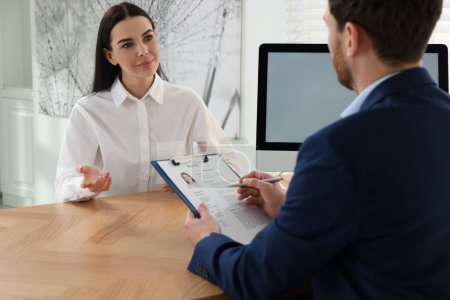 Human resources manager conducting job interview with applicant in office-stock-photo