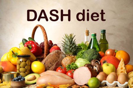 Dash diet (Dietary approaches to stop hypertension). Many different healthy food against beige background