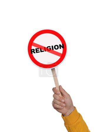 Foto de Concepto de ateísmo. Hombre sosteniendo un cartel de prohibición con la palabra tachada Religión sobre fondo blanco - Imagen libre de derechos