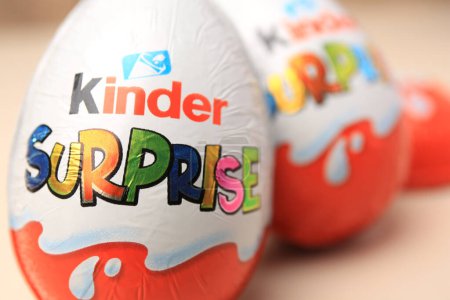 Photo for Slynchev Bryag, Bulgaria - May 25, 2023: Kinder Surprise Eggs on blurred background, closeup. Space for text - Royalty Free Image