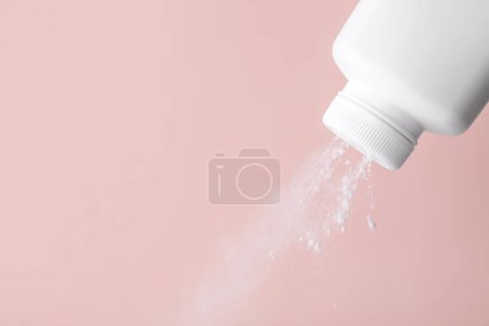 Photo for Scattering of baby powder on pink background, closeup. Space for text - Royalty Free Image