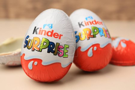 Photo for Slynchev Bryag, Bulgaria - May 25, 2023: Kinder Surprise Eggs on beige background, closeup - Royalty Free Image