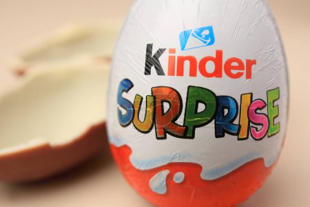 Photo for Slynchev Bryag, Bulgaria - May 25, 2023: Kinder Surprise Egg on blurred background, closeup - Royalty Free Image
