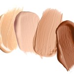 Foundation of various shades for different skin tones isolated on white, top view. Set of samples