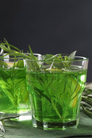 Photo for Glasses of refreshing tarragon drink on table, closeup - Royalty Free Image