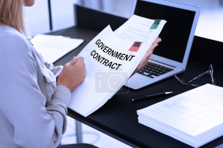 Photo for Government contract. Woman reading document at table, closeup - Royalty Free Image