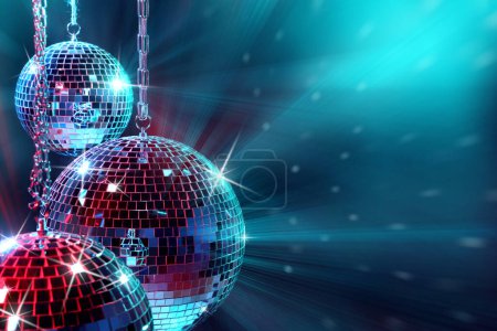 Photo for Shiny disco balls under bright cyan light, space for text - Royalty Free Image