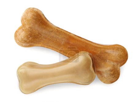 Téléchargez les photos : Mâcher des os pour chien isolé sur blanc, vue de dessus. Jouets pour animaux - en image libre de droit