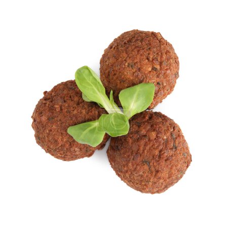 Photo for Delicious falafel balls and lambs lettuce on white background, top view. Vegan meat products - Royalty Free Image