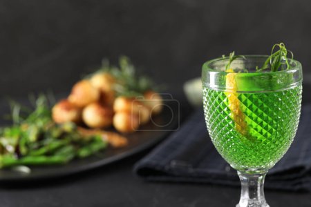 Photo for Delicious drink with tarragon in glass on dark table, closeup. Space for text - Royalty Free Image