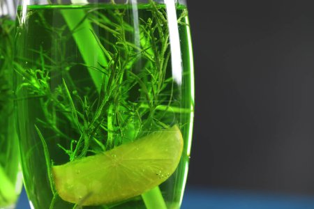 Photo for Glass of homemade refreshing tarragon drink with lemon slice, closeup - Royalty Free Image