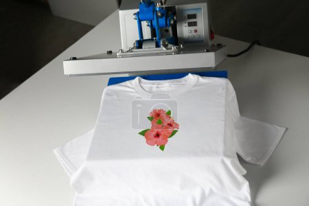 Photo for Custom t-shirt. Using heat press to print image of beautiful hibiscus flowers - Royalty Free Image