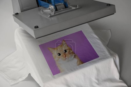 Photo for Custom t-shirt. Using heat press to print photo of cute ginger cat - Royalty Free Image