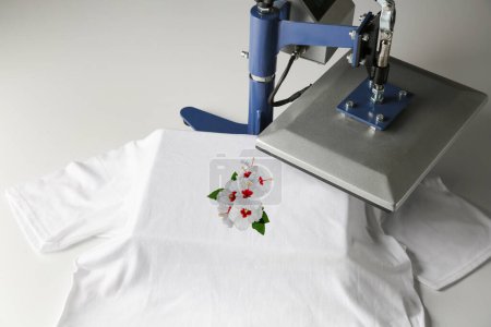 Photo for Custom t-shirt. Using heat press to print image of beautiful hibiscus flowers - Royalty Free Image