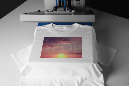 Photo for Custom t-shirt. Using heat press to print image of beautiful sunset sky - Royalty Free Image