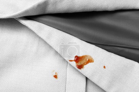 Photo for Dirty jacket with stains of sauce, top view - Royalty Free Image