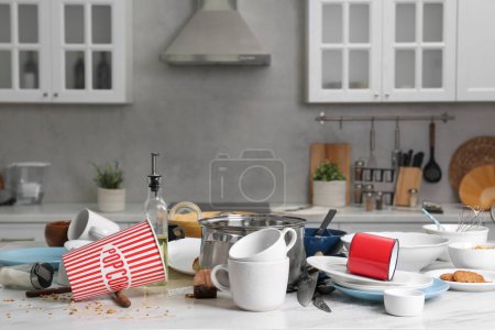 Photo for Many dirty utensils, dishware and food leftovers on white table. Mess in kitchen - Royalty Free Image