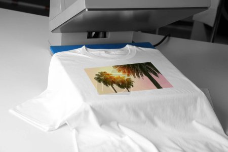 Photo for Custom t-shirt. Using heat press to print image of beautiful tropical palm trees, closeup - Royalty Free Image