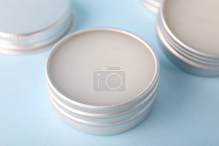 Photo for Lip balms on light blue background, closeup - Royalty Free Image