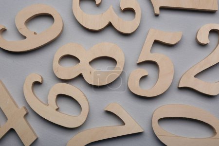 Photo for Wooden numbers on light grey background, flat lay - Royalty Free Image