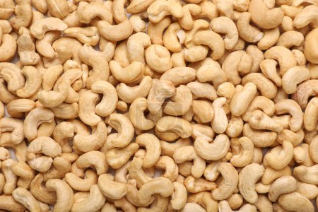 Photo for Many tasty cashew nuts as background, top view - Royalty Free Image