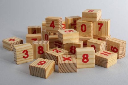 Photo for Wooden cubes with numbers and mathematical symbols on light background - Royalty Free Image