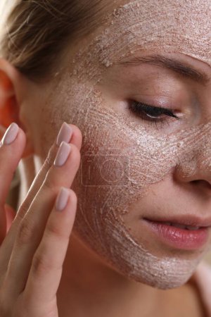 Woman with face mask, closeup. Spa treatments