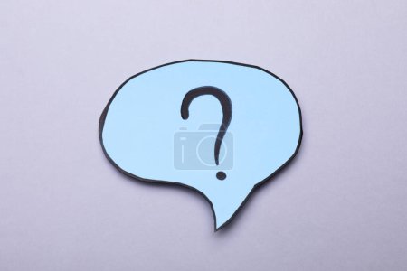 Photo for Paper speech bubble with question mark on light grey background, top view - Royalty Free Image
