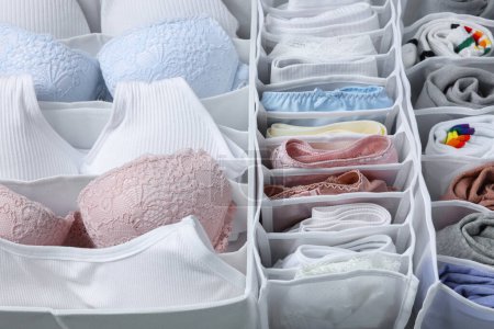 Photo for Organizers with folded women's underwear, closeup view - Royalty Free Image
