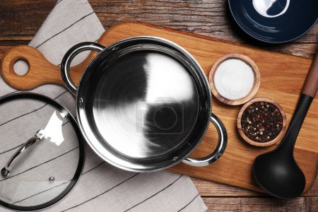 Photo for Flat lay composition of empty pot with lid on wooden table - Royalty Free Image
