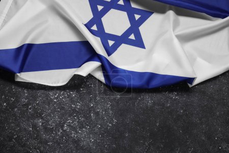Flag of Israel on grey textured background, top view and space for text. National symbol