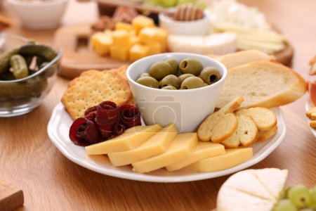 Photo for Assorted appetizers served on wooden table, closeup - Royalty Free Image