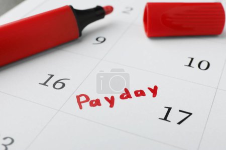 Photo for Red felt pen on calendar page with marked payday date, closeup - Royalty Free Image
