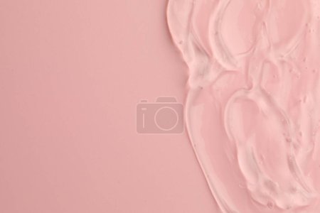 Photo for Clear cosmetic gel on pink background, top view. Space for text - Royalty Free Image
