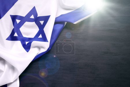 Flag of Israel on black wooden background, top view and space for text. National symbol
