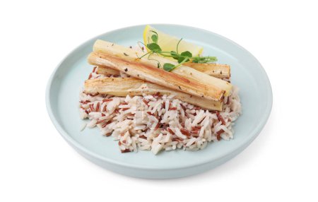 Plate with baked salsify roots, lemon and rice isolated on white