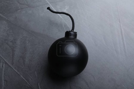 Photo for Sphere shaped bomb with burning fuse on black background, top view - Royalty Free Image