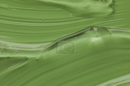 Photo for Clear cosmetic gel on light green background, top view - Royalty Free Image