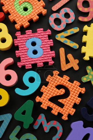 Photo for Many colorful numbers and mathematical symbols on black background, flat lay - Royalty Free Image