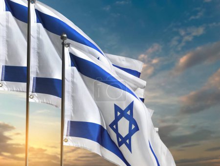 National flags of Israel against blue sky with clouds